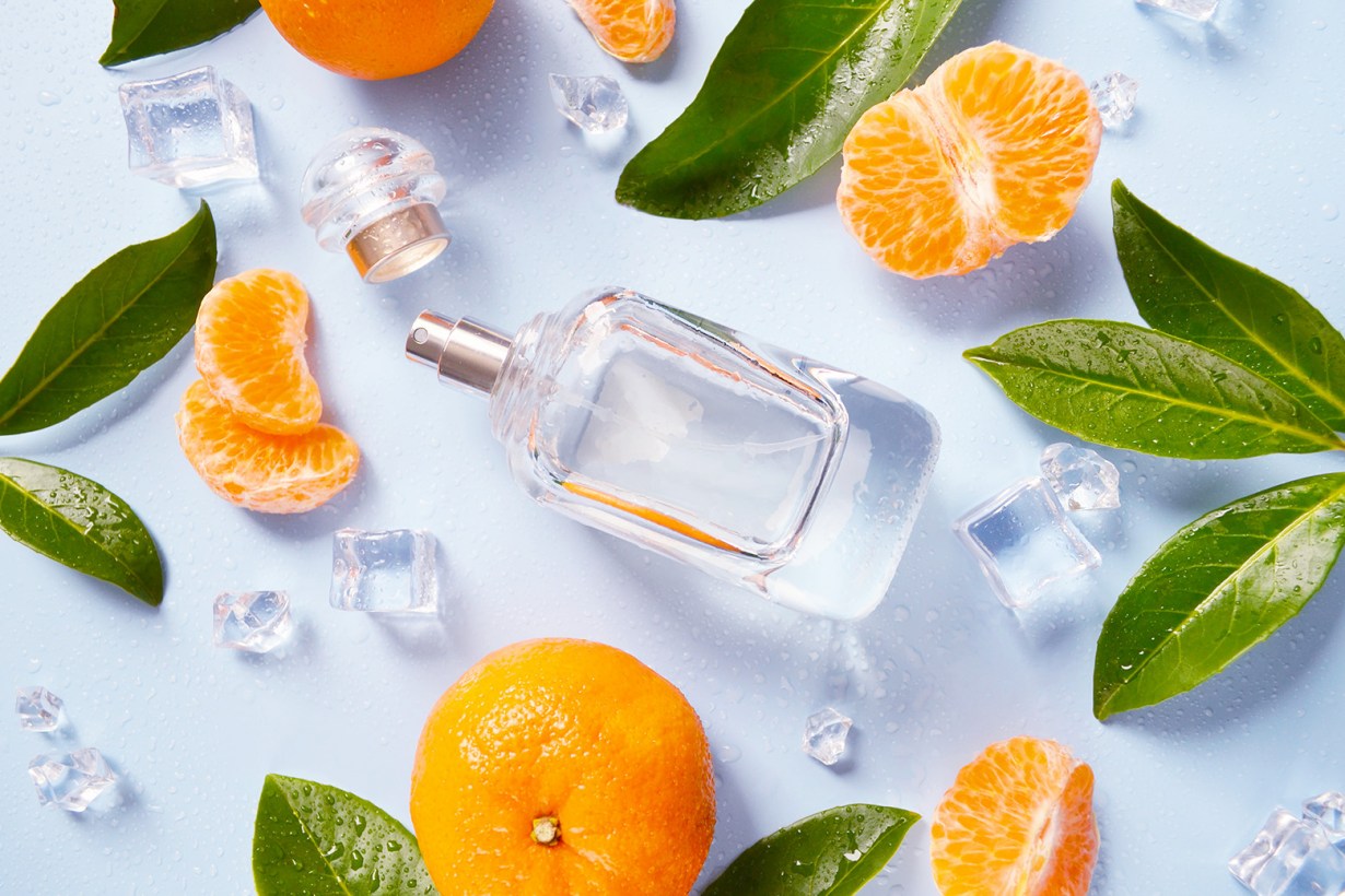 cologne surrounded with ice and oranges