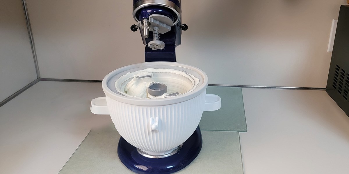KitchenAid Ice Cream Maker Attachment with vanilla ice cream inside KitchenAid Ice Cream Maker Attachment with vanilla ice cream inside