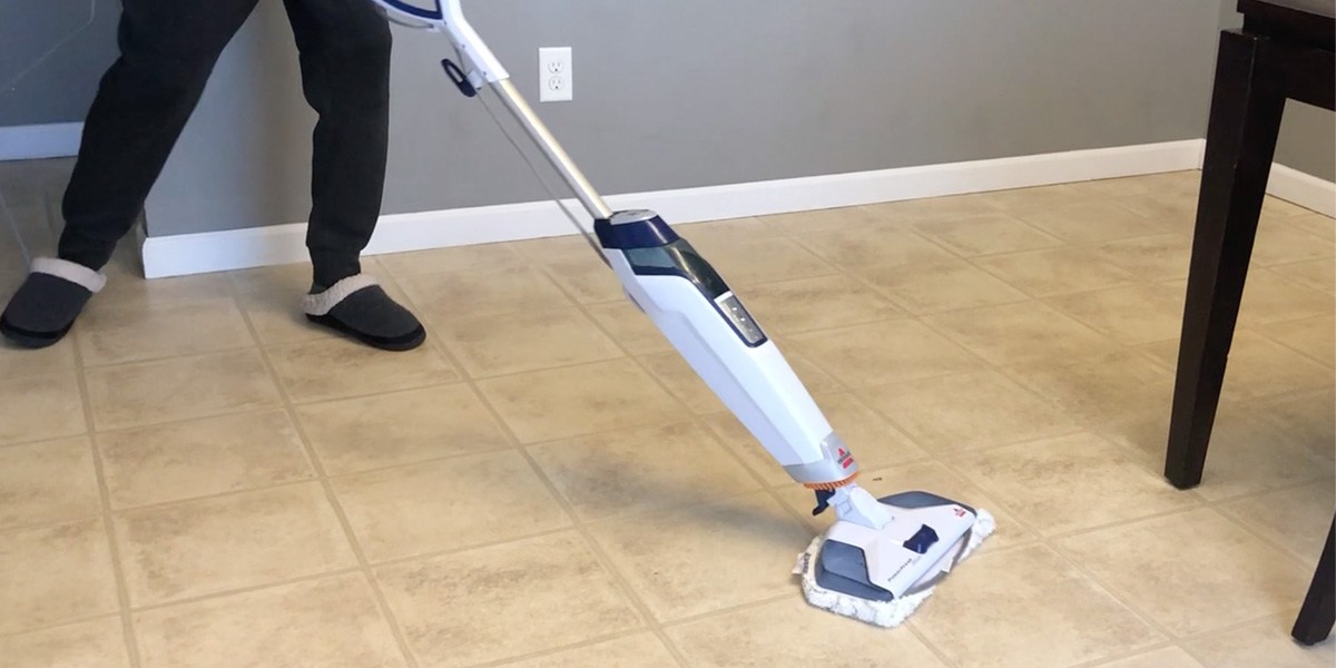 Person mopping floor with Bissell PowerFresh Deluxe 1806 Person mopping floor with Bissell PowerFresh Deluxe 1806