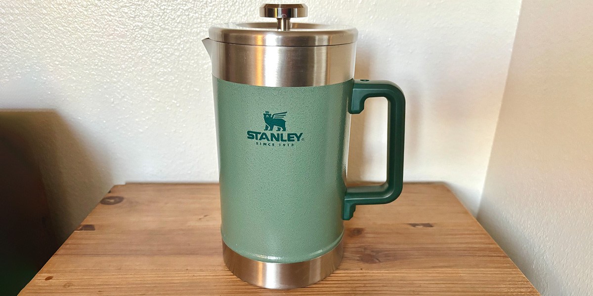 Sage-colored Stanley Classic The Stay Hot French Press on table