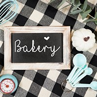 Checked farmhouse tablecloth with Thanksgiving decor