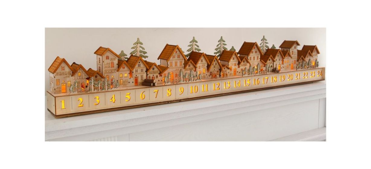 Balsam Hill Wooden Christmas Mantel Village Advent Calendar on a white mantel