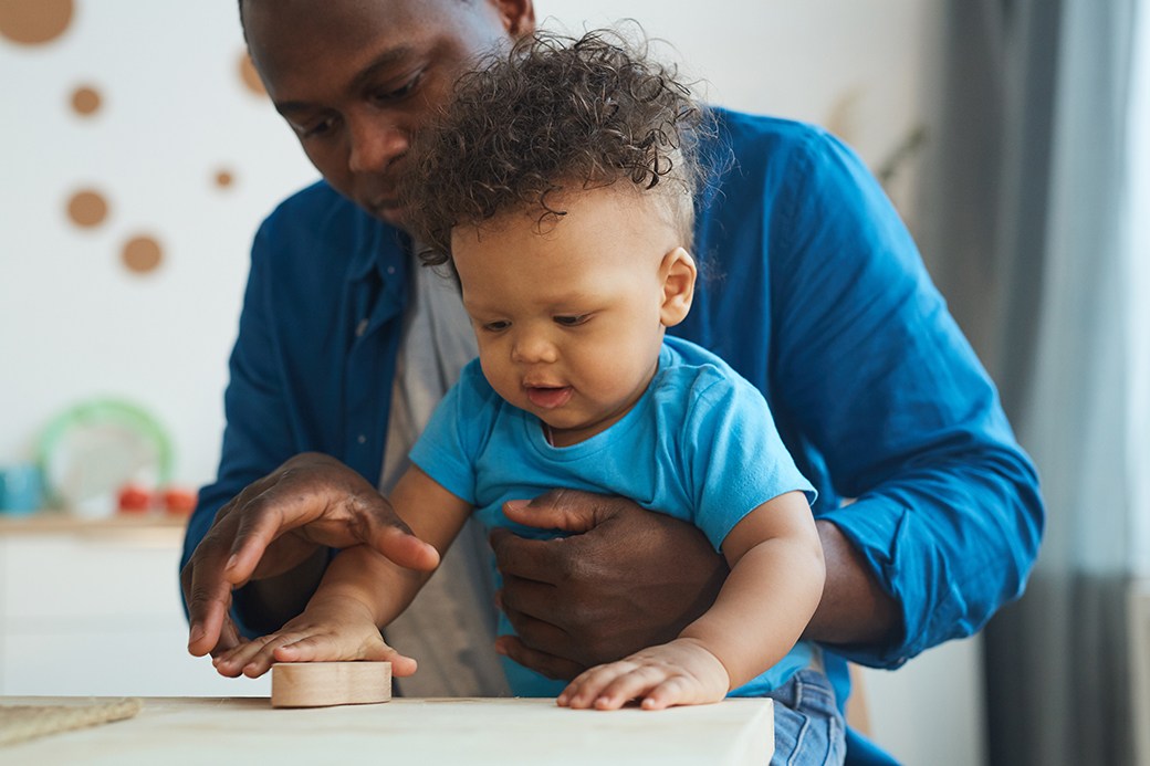 Father with toddler on lap