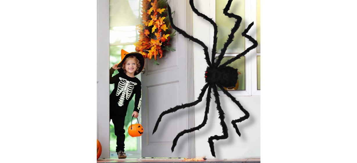 Aiduy Outdoor Halloween Decorations Scary Giant Spider image with child in skeleton costume