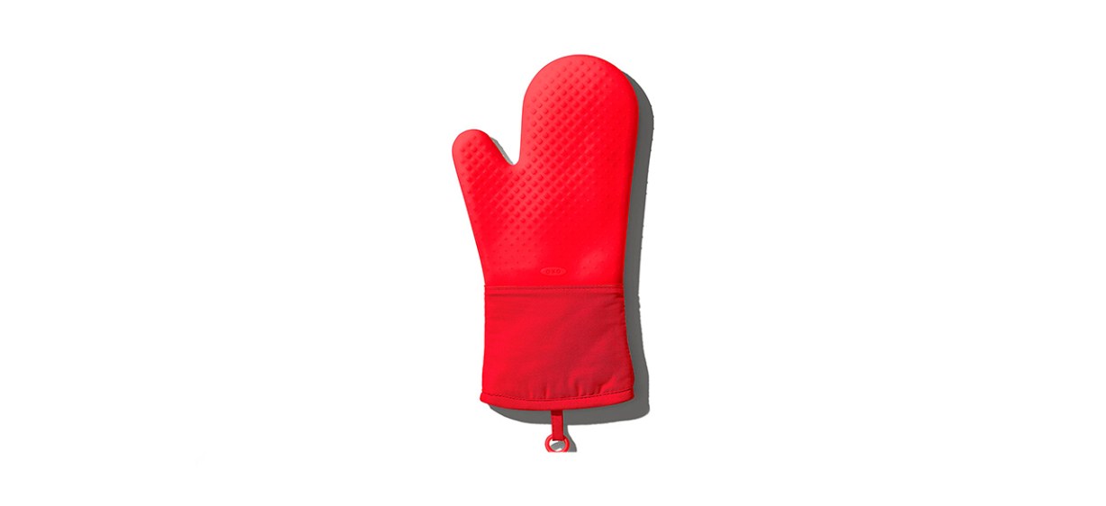 A red silicone oven mitt