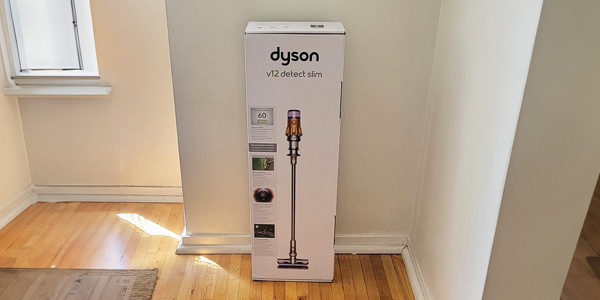 Dyson V12 Detect Slim product packaging against wall